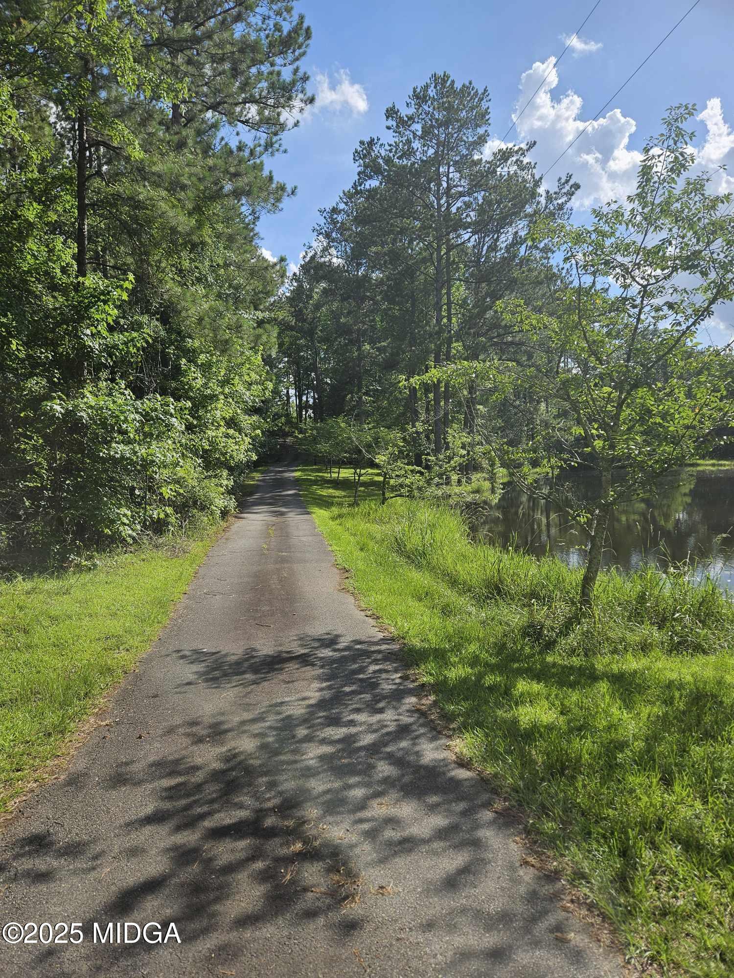156 Rose Down Avenue Gray, GA 31032 - Photo 4 of 46 a view of a street with a yard