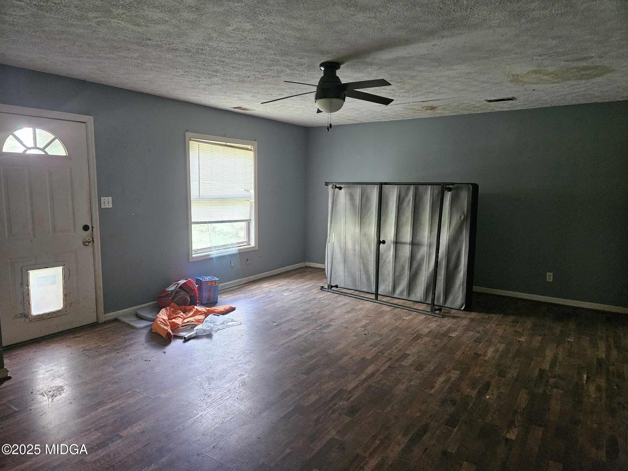 156 Rose Down Avenue Gray, GA 31032 - Photo 41 of 46 a view of a livingroom with wooden floor and a window