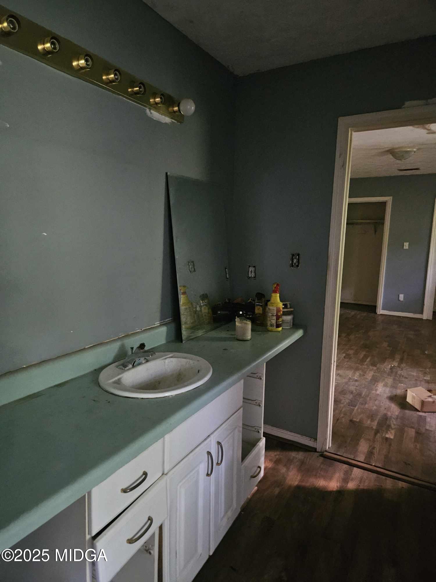 156 Rose Down Avenue Gray, GA 31032 - Photo 44 of 46 a bathroom with a granite countertop sink and a mirror