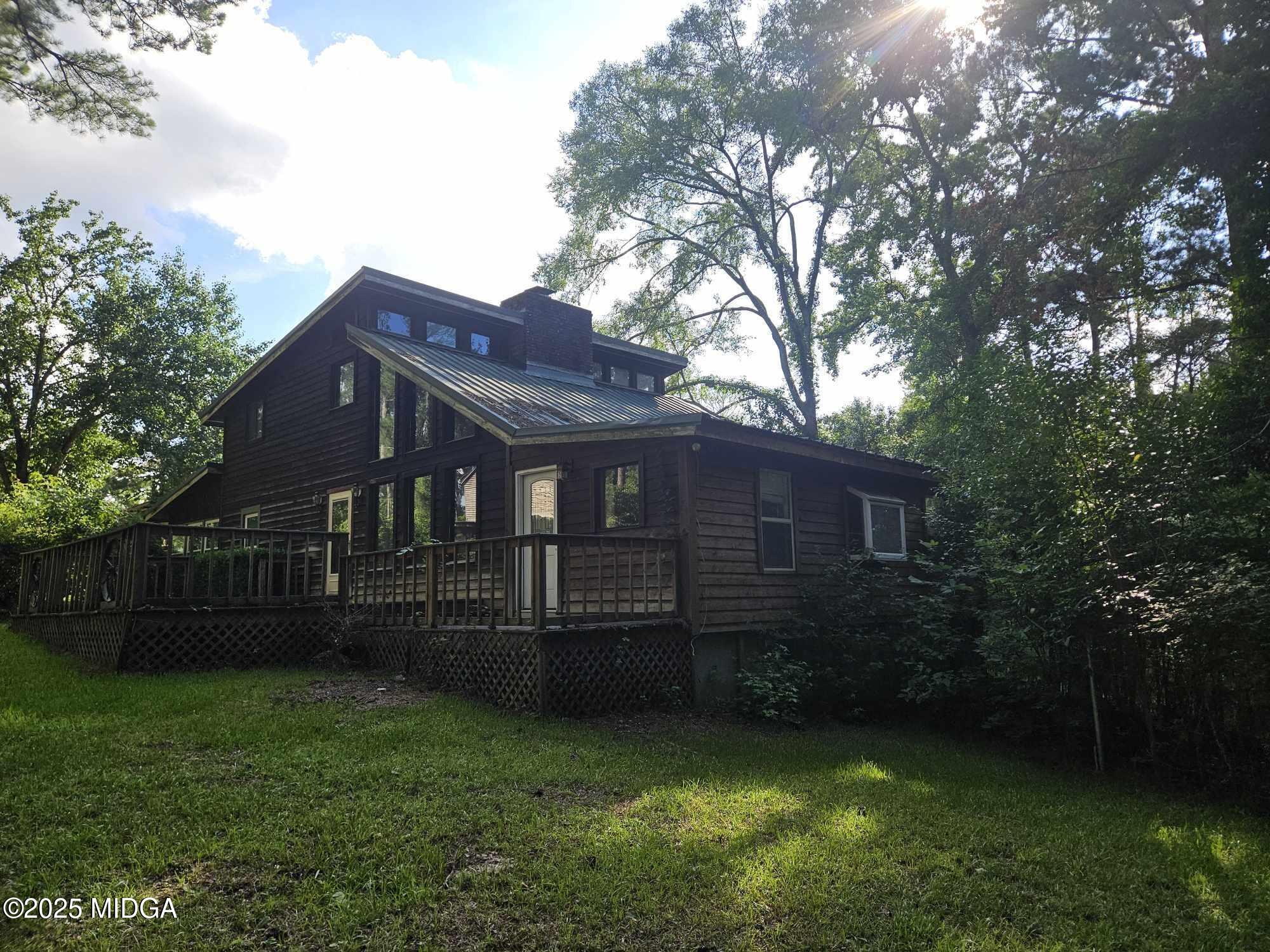 156 Rose Down Avenue Gray, GA 31032 - Photo 8 of 46 a view of a house with a yard