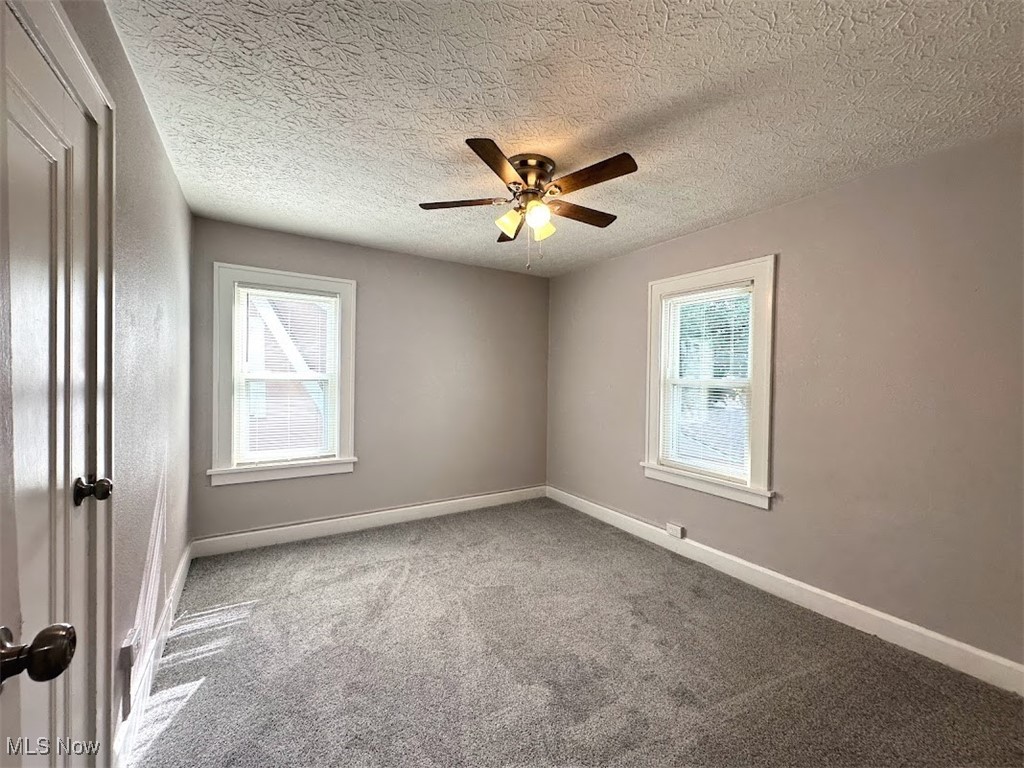 3288 Kildare Road Cleveland, OH 44118 - Photo 10 of 18 Carpeted spare room featuring a textured ceiling and ceiling fan