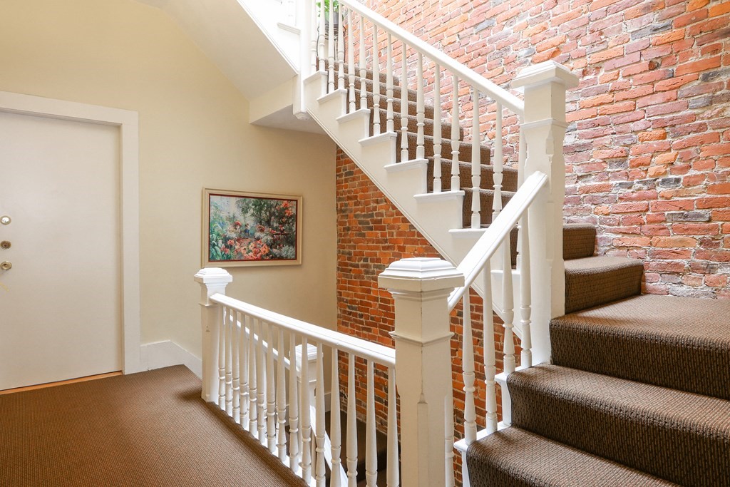 389 Beacon Street, Unit 7 Boston, MA 02116 - Photo 4 of 6 a view of entryway with wooden floor and stairs