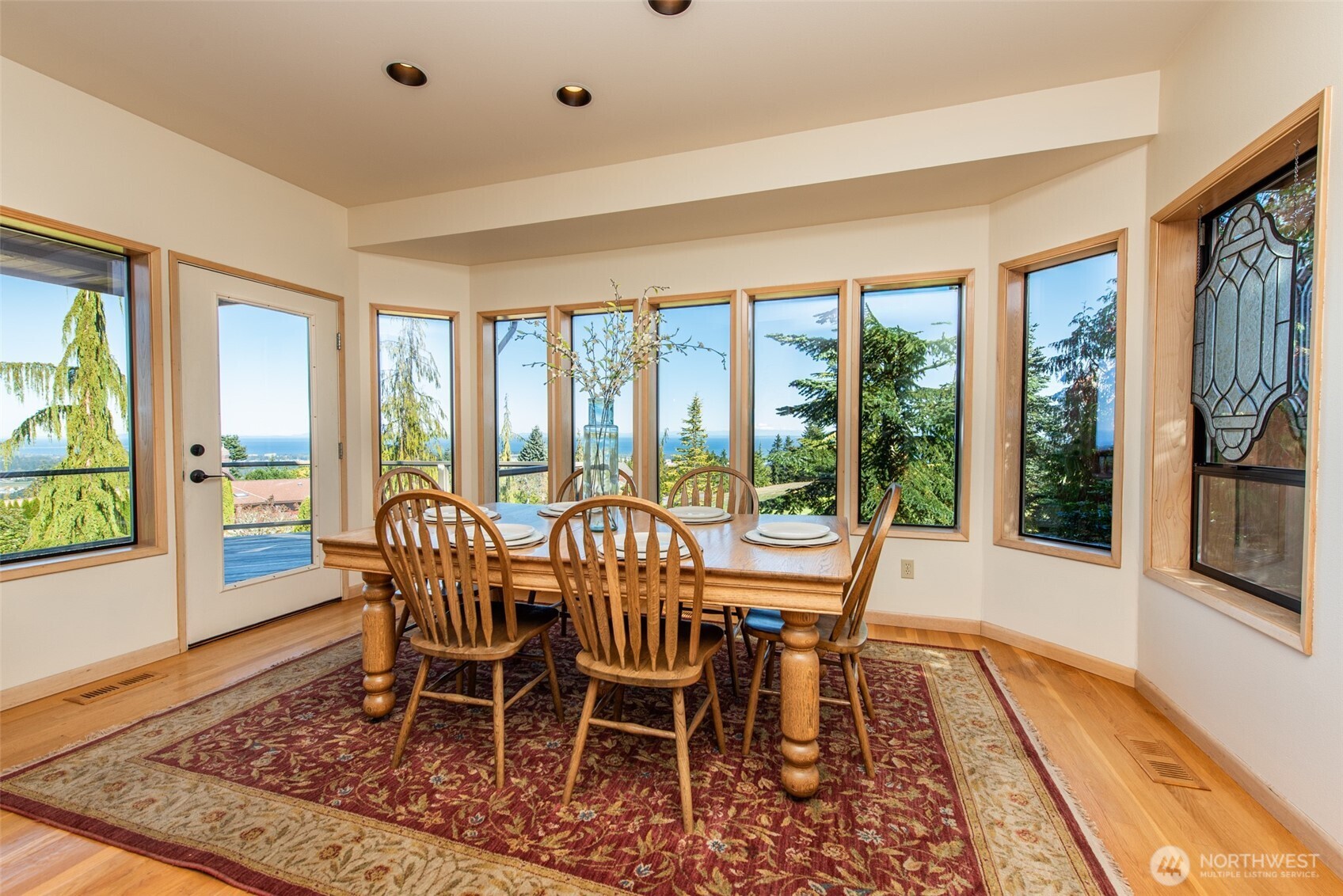 283 Fawn Lane Sequim, WA 98382 - Photo 16 of 38 a view of a dining room with furniture window and wooden floor