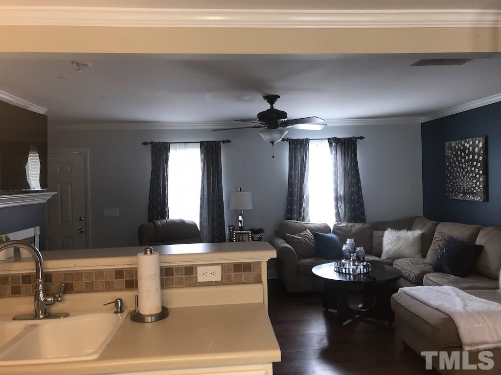 5213 Marthonna Way Raleigh, NC 27616 - Photo 5 of 15 a living room with furniture and a large window