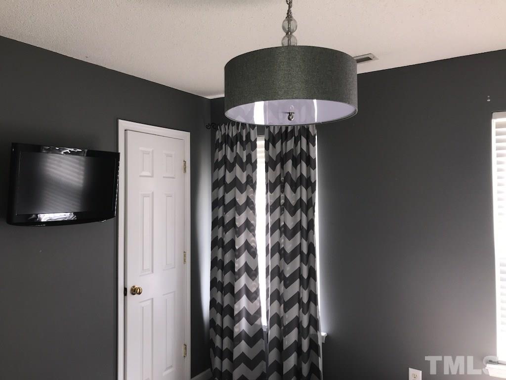 5213 Marthonna Way Raleigh, NC 27616 - Photo 10 of 15 a top view of a chandelier in a room