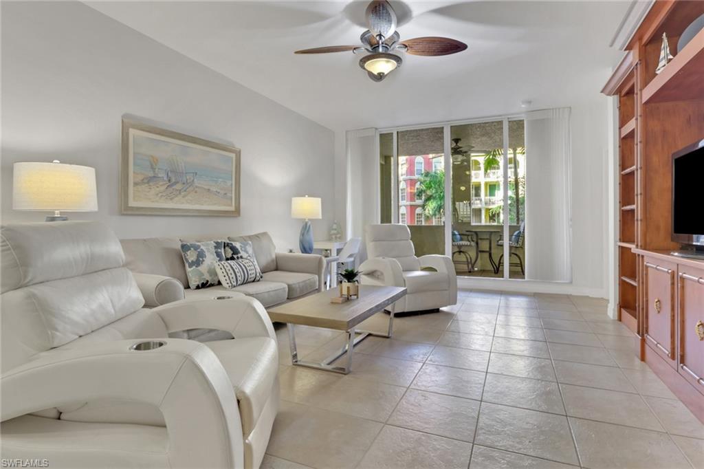 401 Bayfront Place, Unit 3207 Naples, FL 34102 - Photo 1 of 22 Living area with expansive windows and a ceiling fan