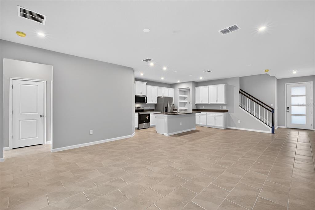 3352 Timber Xing Avenue Brandon, FL 33511 - Photo 12 of 35 a view of kitchen with kitchen island white cabinets appliances and center island