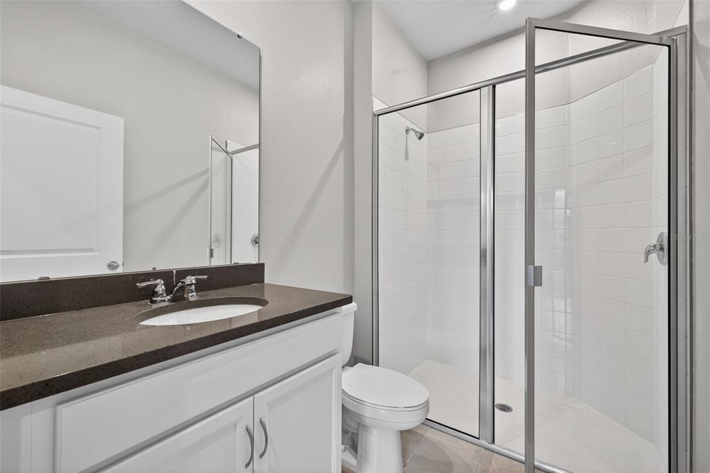 3352 Timber Xing Avenue Brandon, FL 33511 - Photo 17 of 35 a bathroom with a sink and a mirror