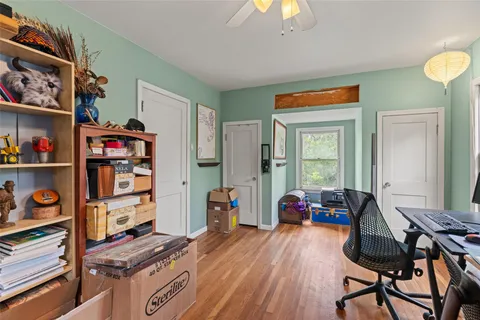 a workspace with furniture and wooden floor