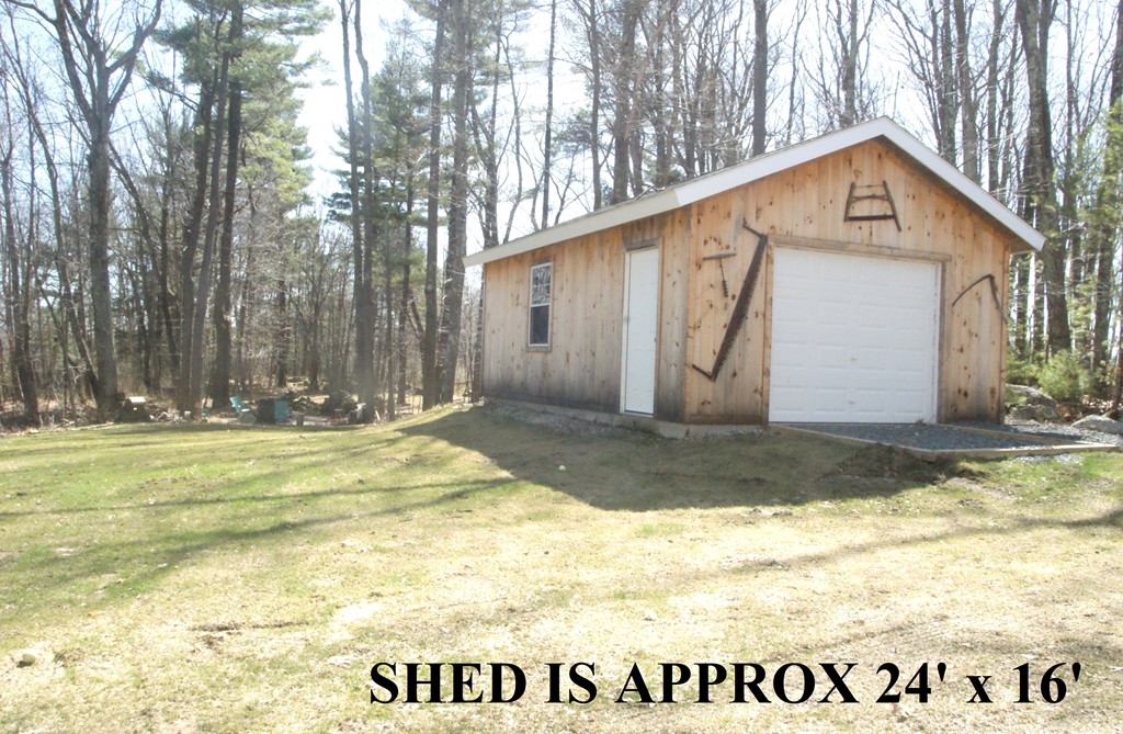 82 Baker Pond Road Dudley, MA 01571 - Photo 14 of 29 a view of a house with backyard and tree