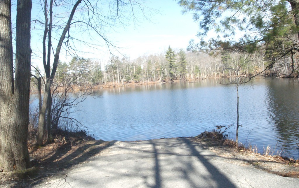 82 Baker Pond Road Dudley, MA 01571 - Photo 4 of 29 a view of a lake from a building