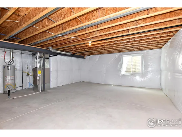 a bathroom with a granite countertop sink a mirror and a toilet