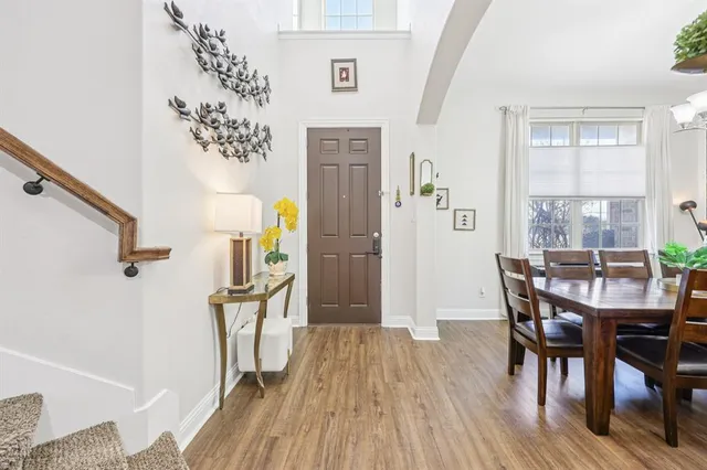 a view of a dining room with furniture window and wooden floor
