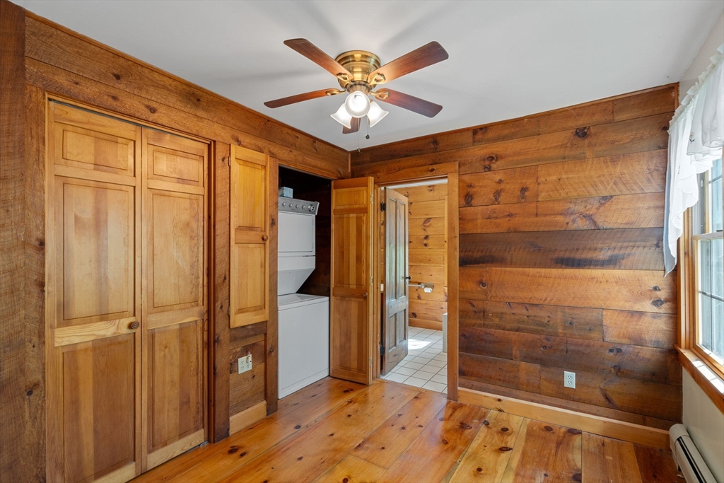362 Snows Pond Road Rochester, MA 02770 - Photo 14 of 41 a view of a hallway with closet and wooden floor