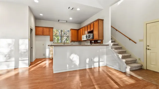a view of a kitchen with furniture and staircase