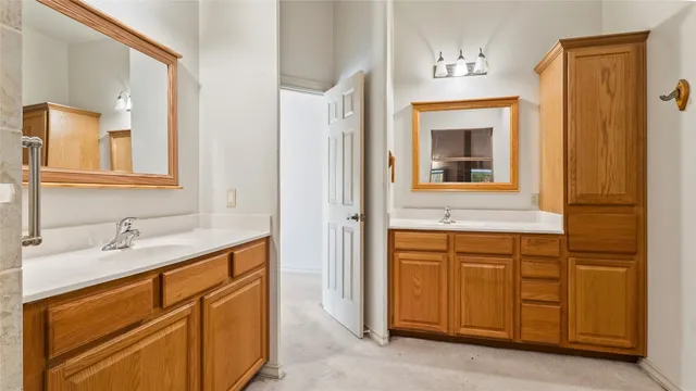 a bathroom with a sink vanity and mirror