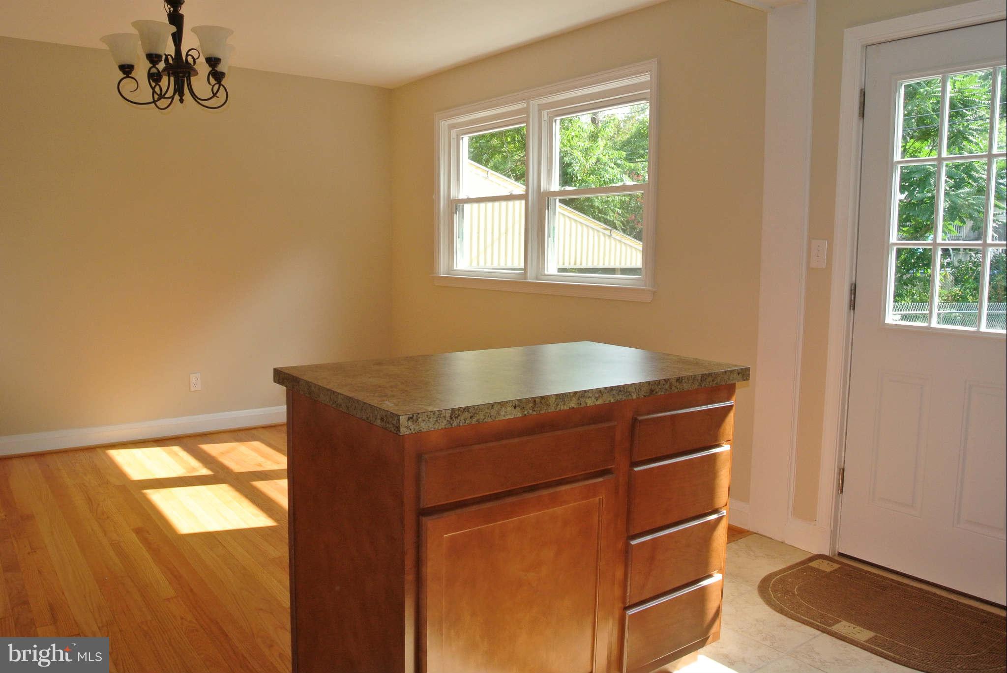 1176 Newfield Road Baltimore, MD 21207 - Photo 10 of 25 Kitchen opens into dining room