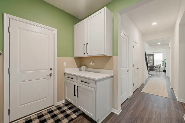 a kitchen with a stove and a refrigerator