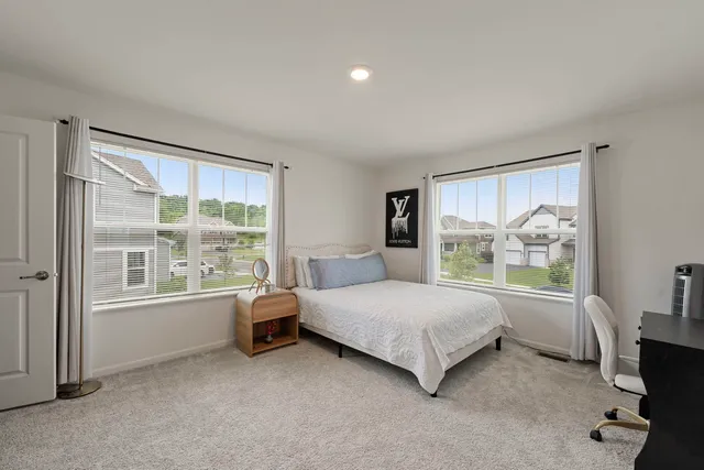 a room with a bed and a window