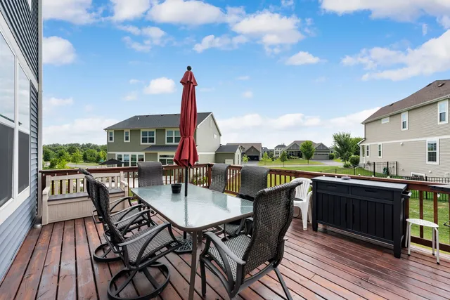 a front view of a house with a yard table and chairs