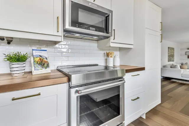 a kitchen with a stove and a microwave