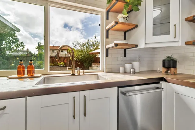 a kitchen with a sink and a window