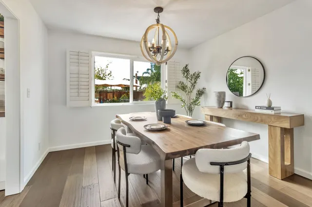 a view of a dining room with furniture window and outside view