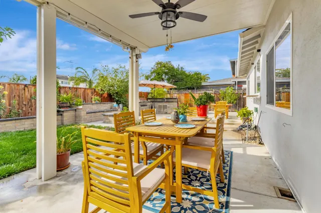 a view of an outdoor dining space with furniture
