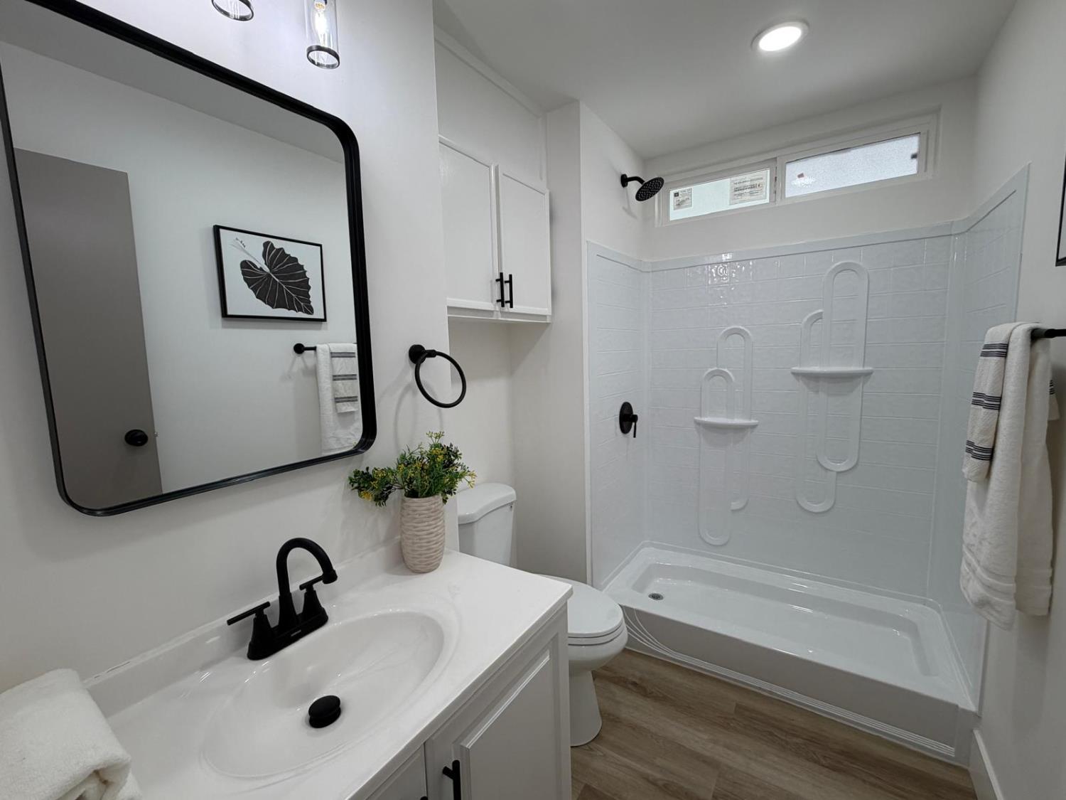 3 Rimma Way Roseville, CA 95661 - Photo 13 of 38 a bathroom with a sink and mirror with bathtub