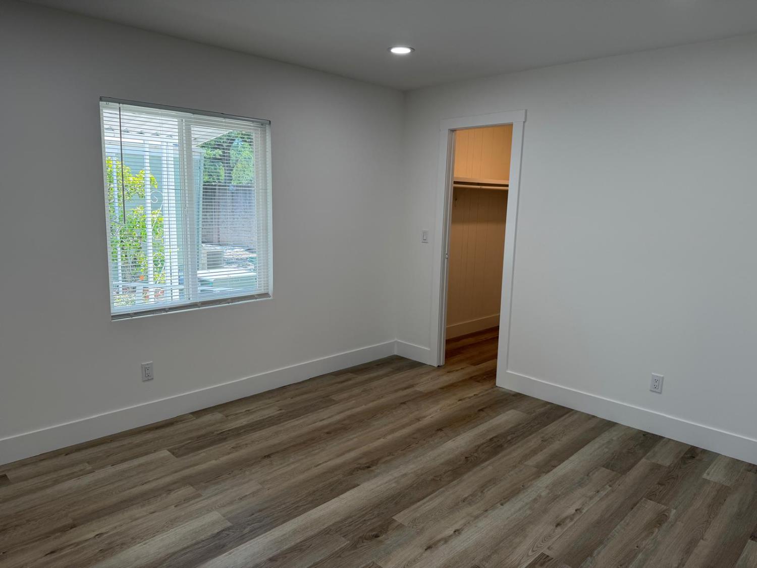3 Rimma Way Roseville, CA 95661 - Photo 16 of 38 a view of an empty room with wooden floor and a window