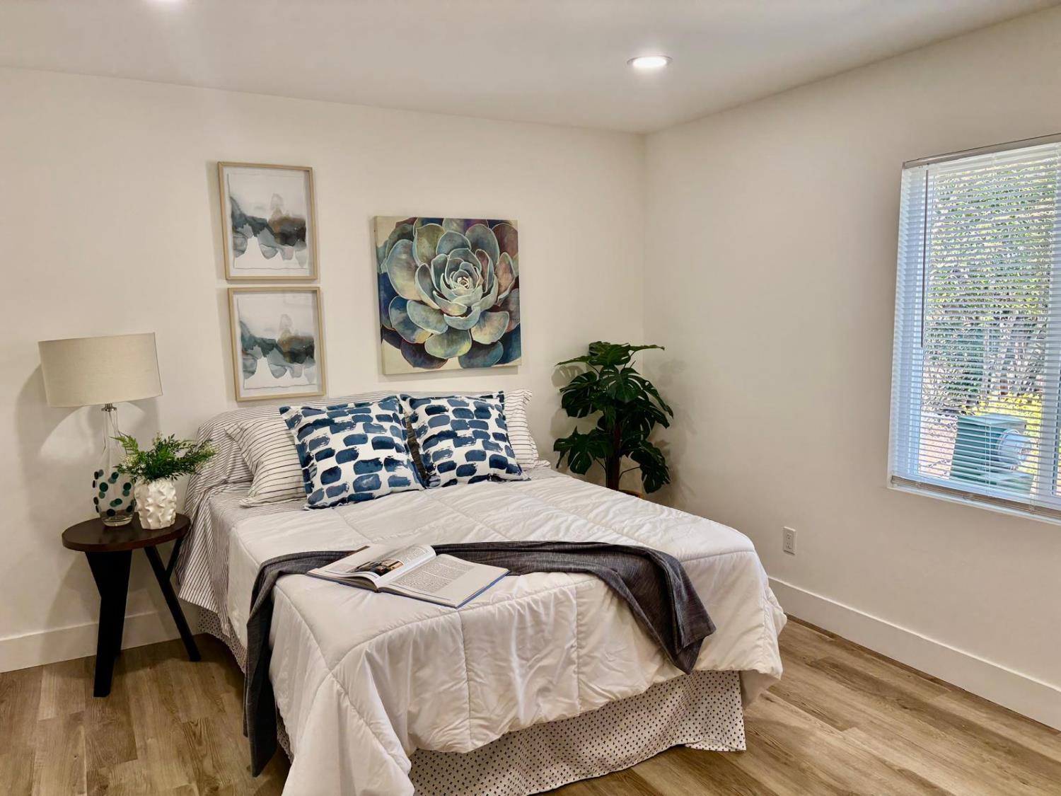 3 Rimma Way Roseville, CA 95661 - Photo 19 of 38 a bedroom with a bed and a painting on the wall