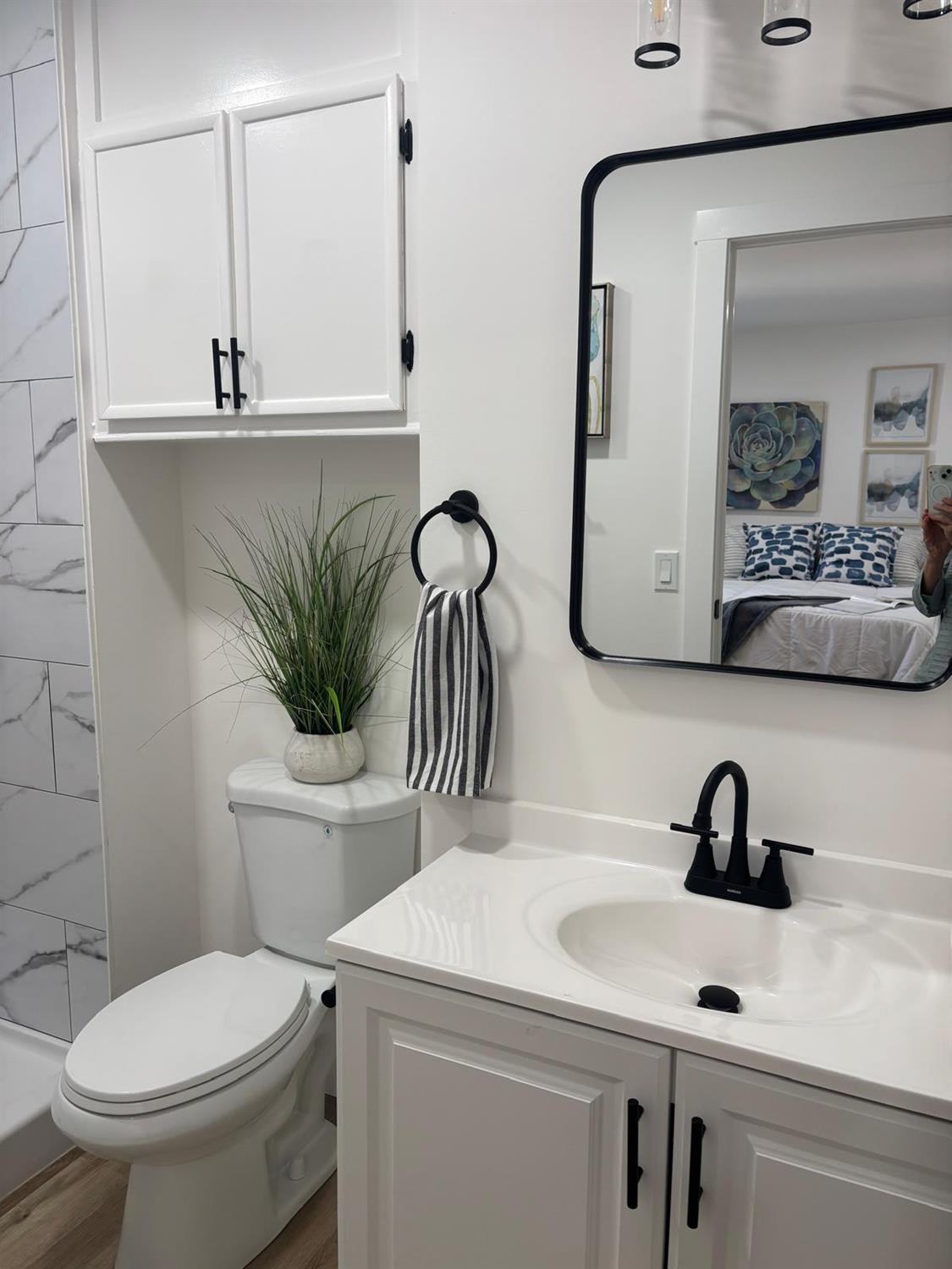 3 Rimma Way Roseville, CA 95661 - Photo 23 of 38 a bathroom with a toilet sink and mirror