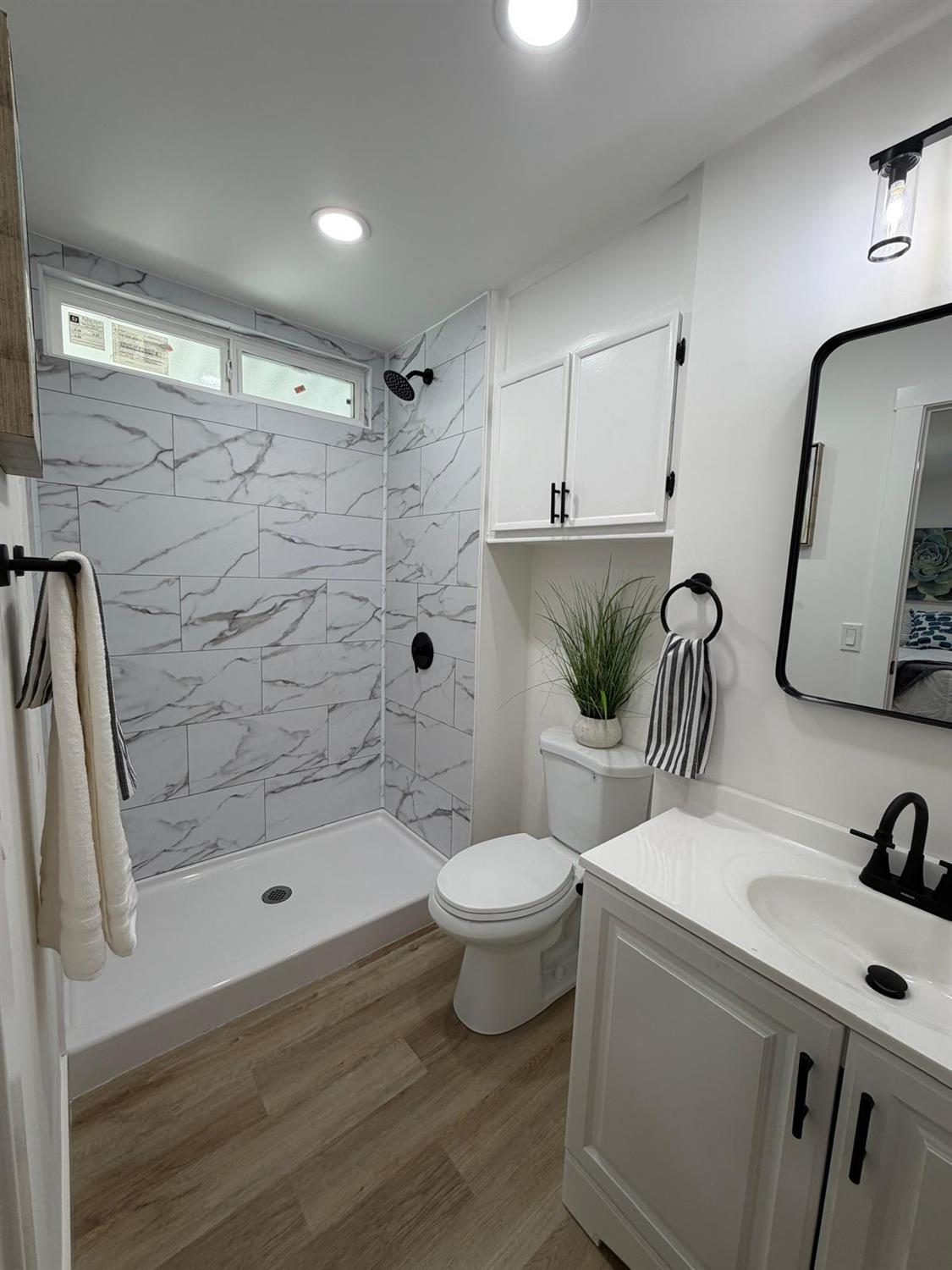 3 Rimma Way Roseville, CA 95661 - Photo 24 of 38 a bathroom with a sink a toilet and shower