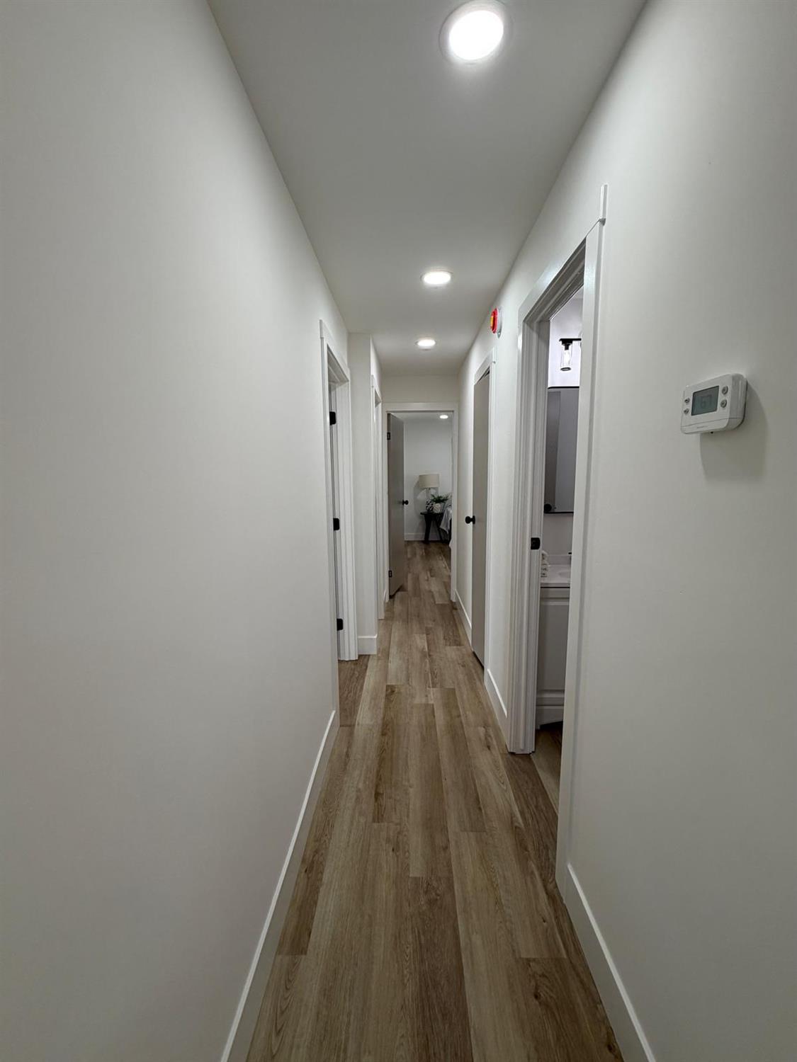 3 Rimma Way Roseville, CA 95661 - Photo 25 of 38 a view of a hallway with wooden floor