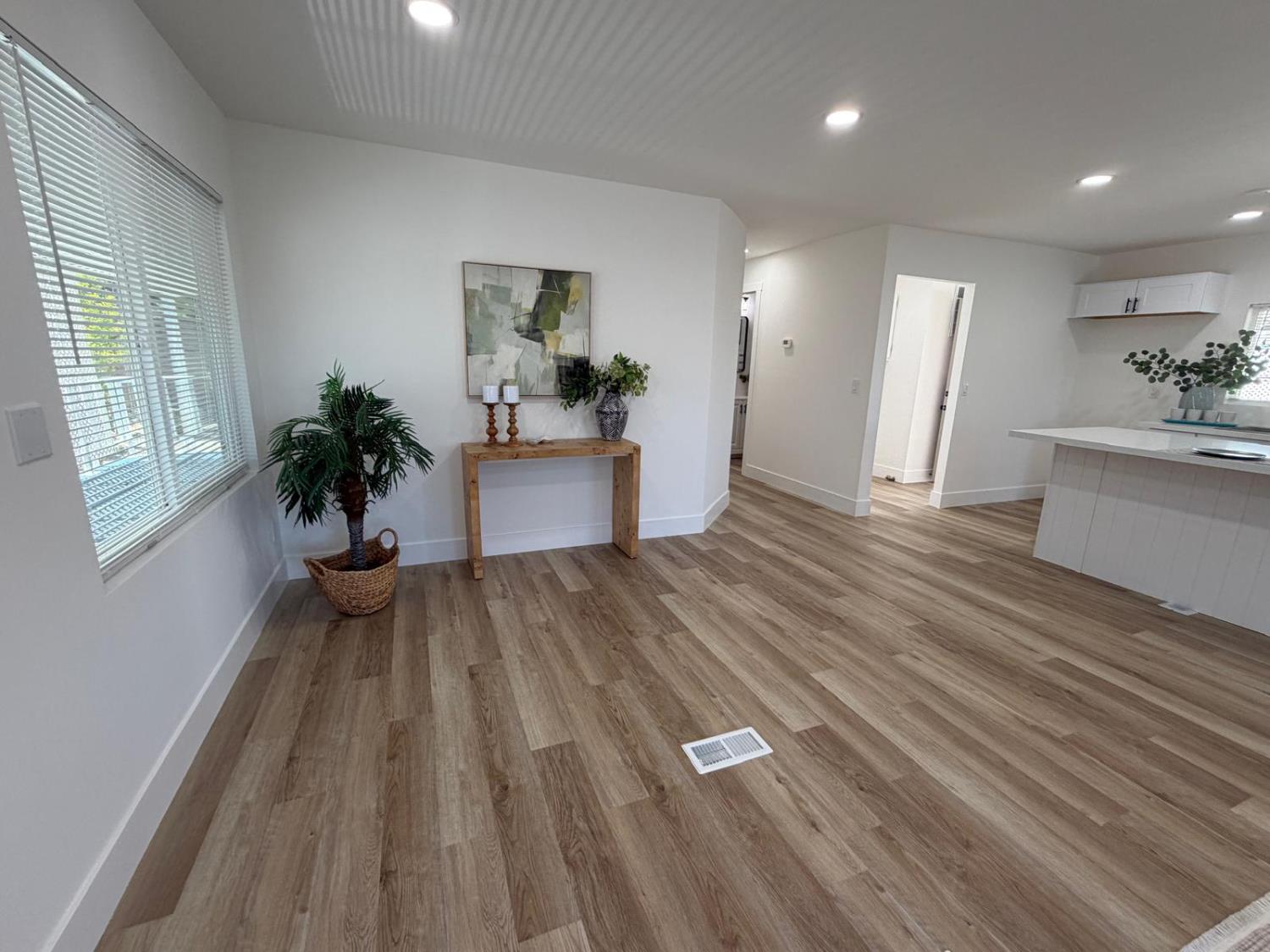 3 Rimma Way Roseville, CA 95661 - Photo 9 of 38 a view of a living room and kitchen with wooden floor