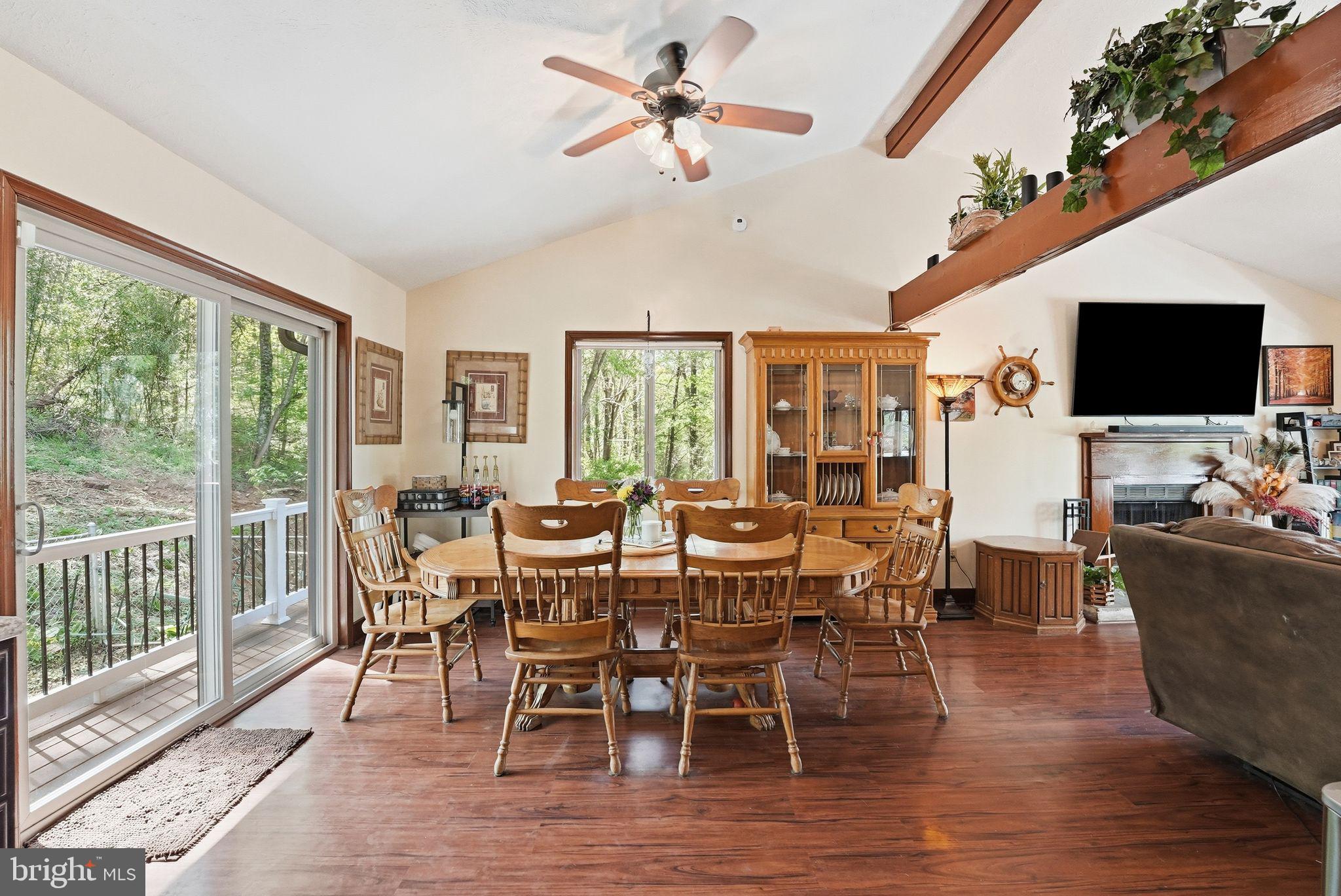 648 Creek Road Front Royal, VA 22630 - Photo 17 of 72 a view of a dining room with furniture window and wooden floor