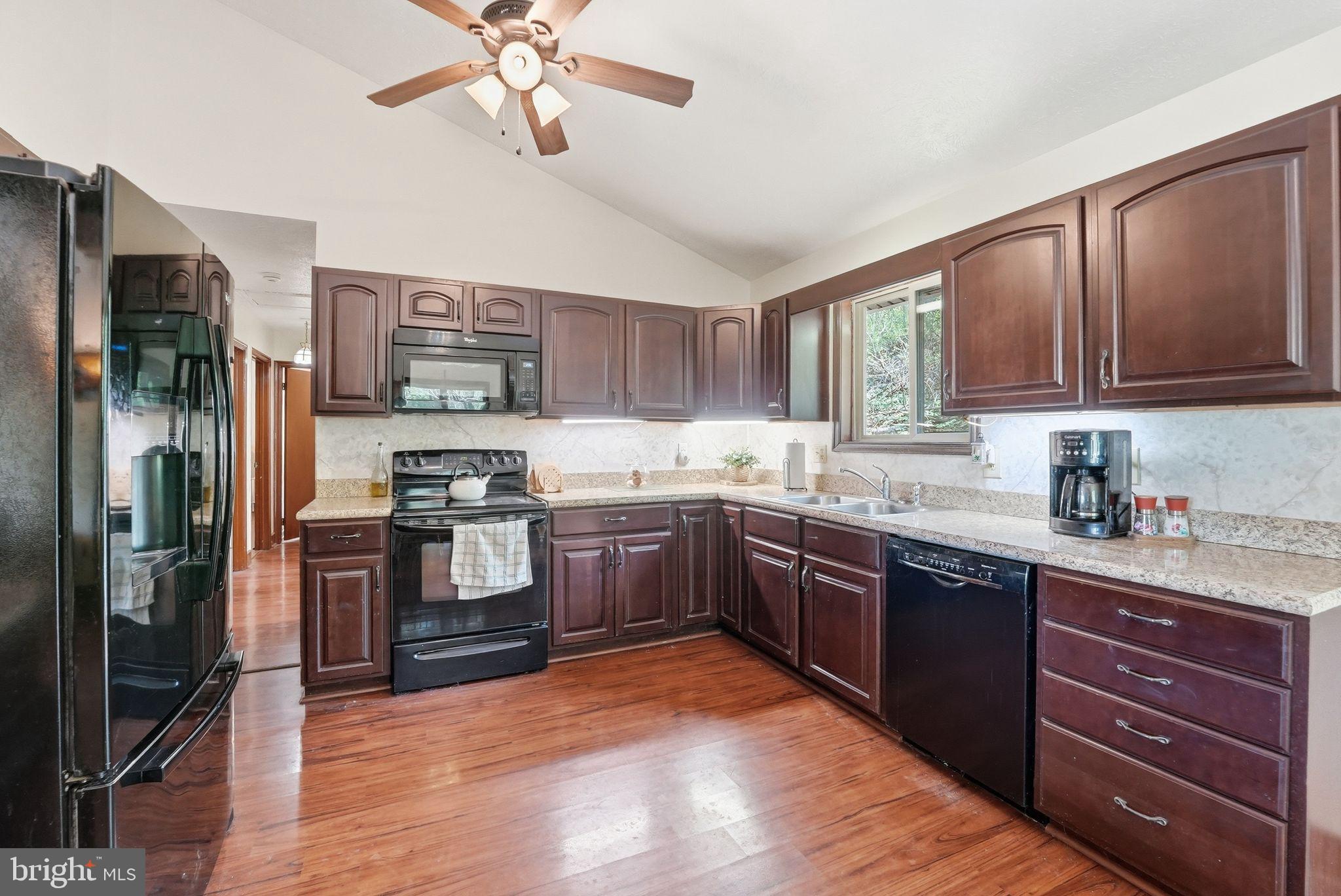 648 Creek Road Front Royal, VA 22630 - Photo 21 of 72 a kitchen with stainless steel appliances granite countertop a refrigerator stove and sink