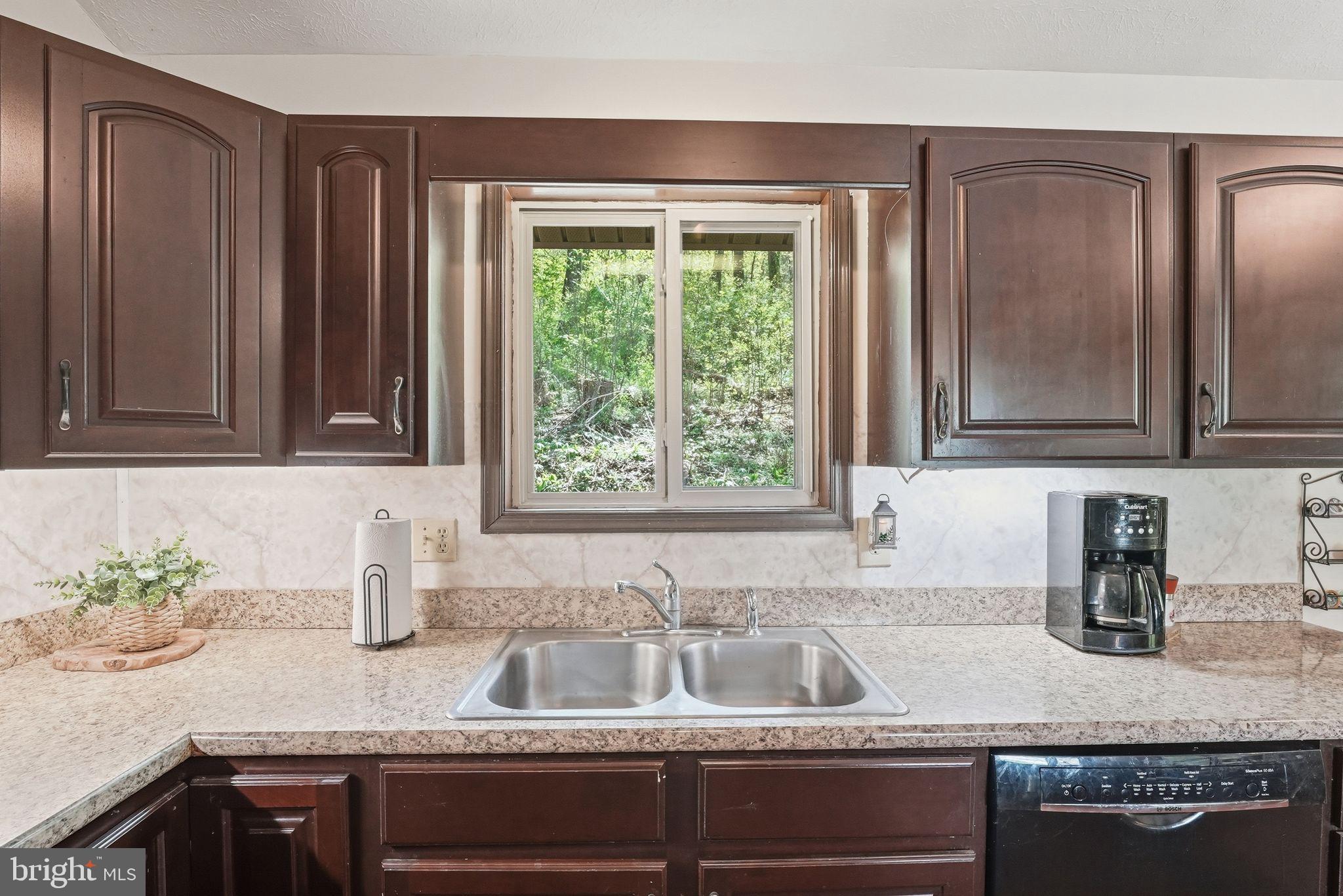 648 Creek Road Front Royal, VA 22630 - Photo 22 of 72 a kitchen with granite countertop stainless steel appliances sink and window