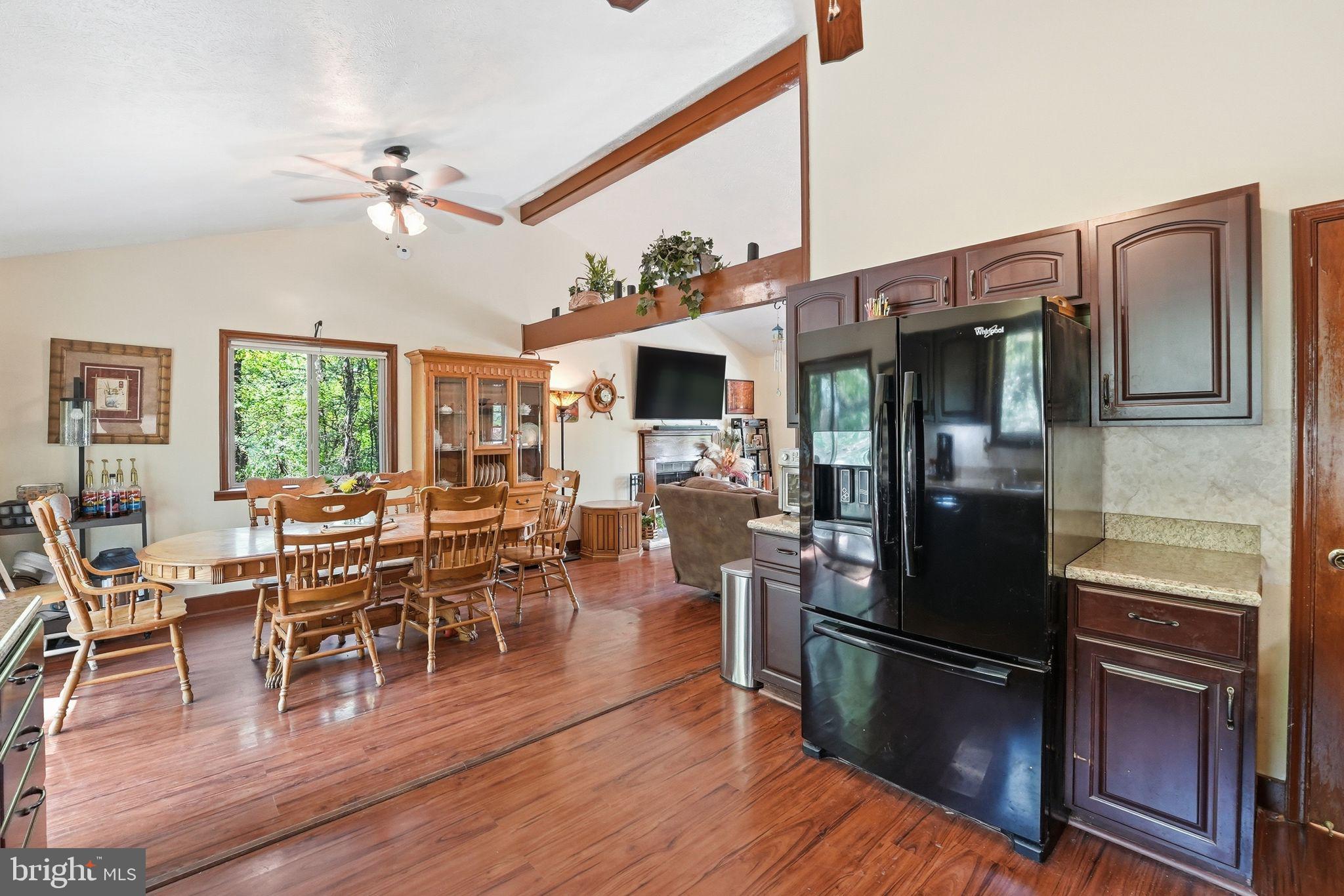 648 Creek Road Front Royal, VA 22630 - Photo 23 of 72 a view of a dining room with furniture window and wooden floor