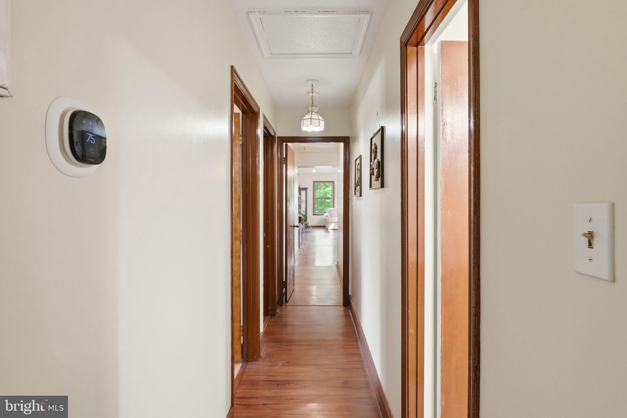 648 Creek Road Front Royal, VA 22630 - Photo 24 of 72 a view of a hallway with wooden floor and a large window