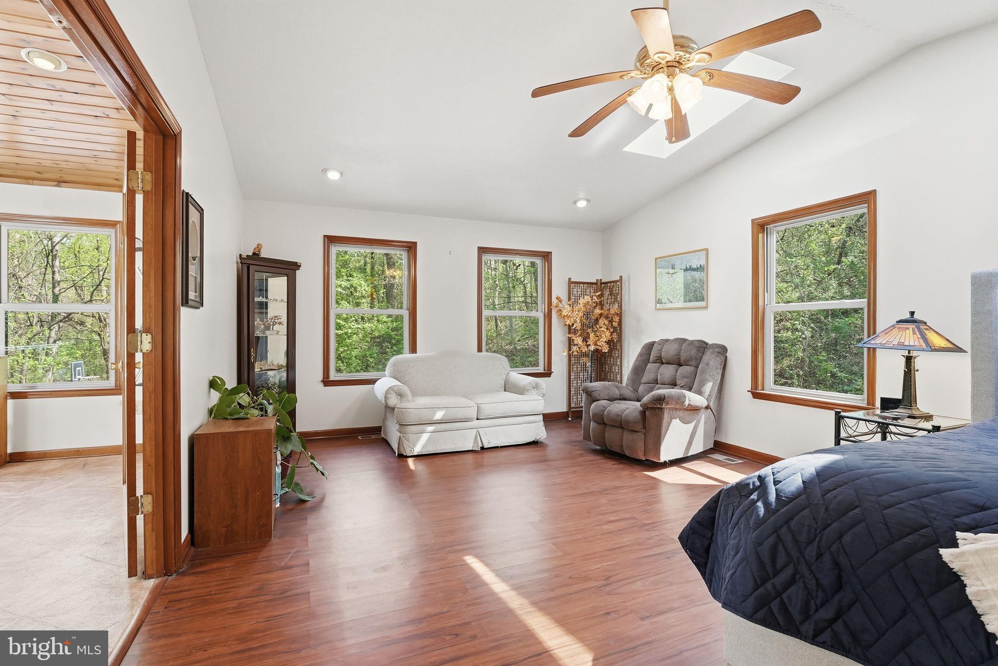 648 Creek Road Front Royal, VA 22630 - Photo 27 of 72 a living room with furniture and a large window