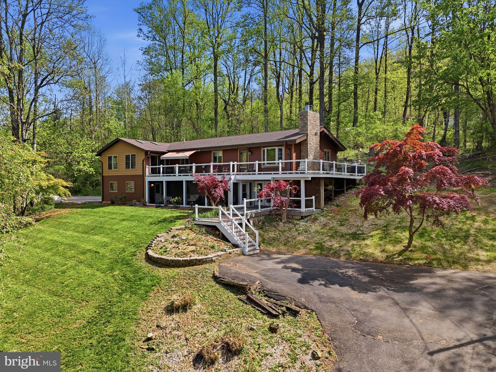 648 Creek Road Front Royal, VA 22630 - Photo 3 of 72 a front view of a house with a garden
