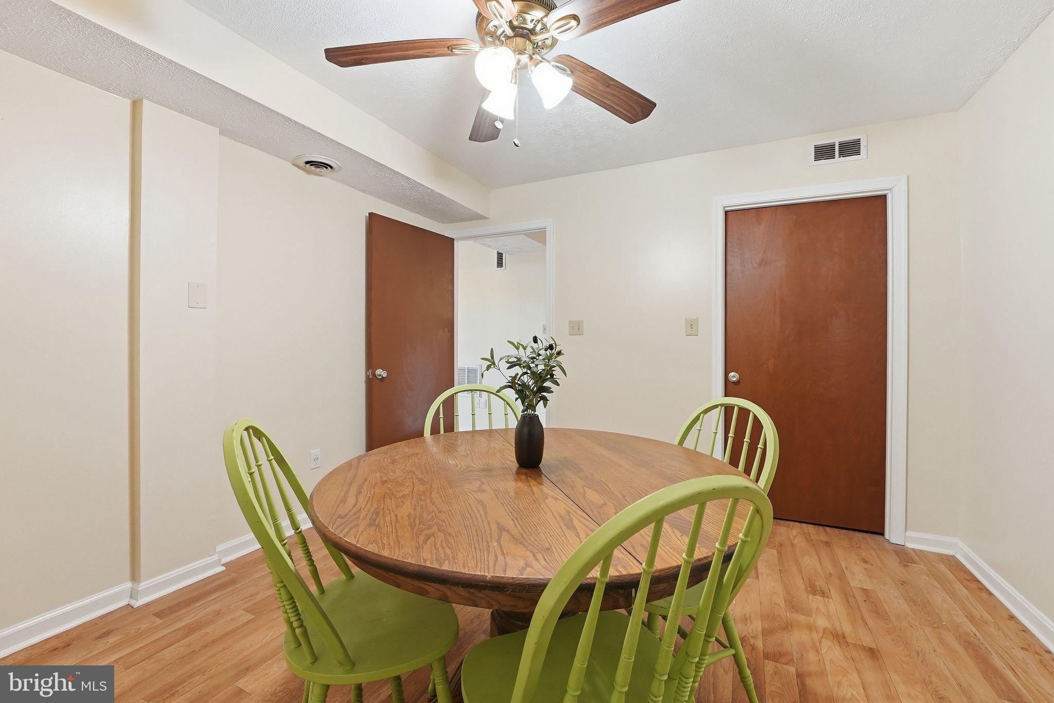648 Creek Road Front Royal, VA 22630 - Photo 42 of 72 a view of a dining room with furniture and wooden floor