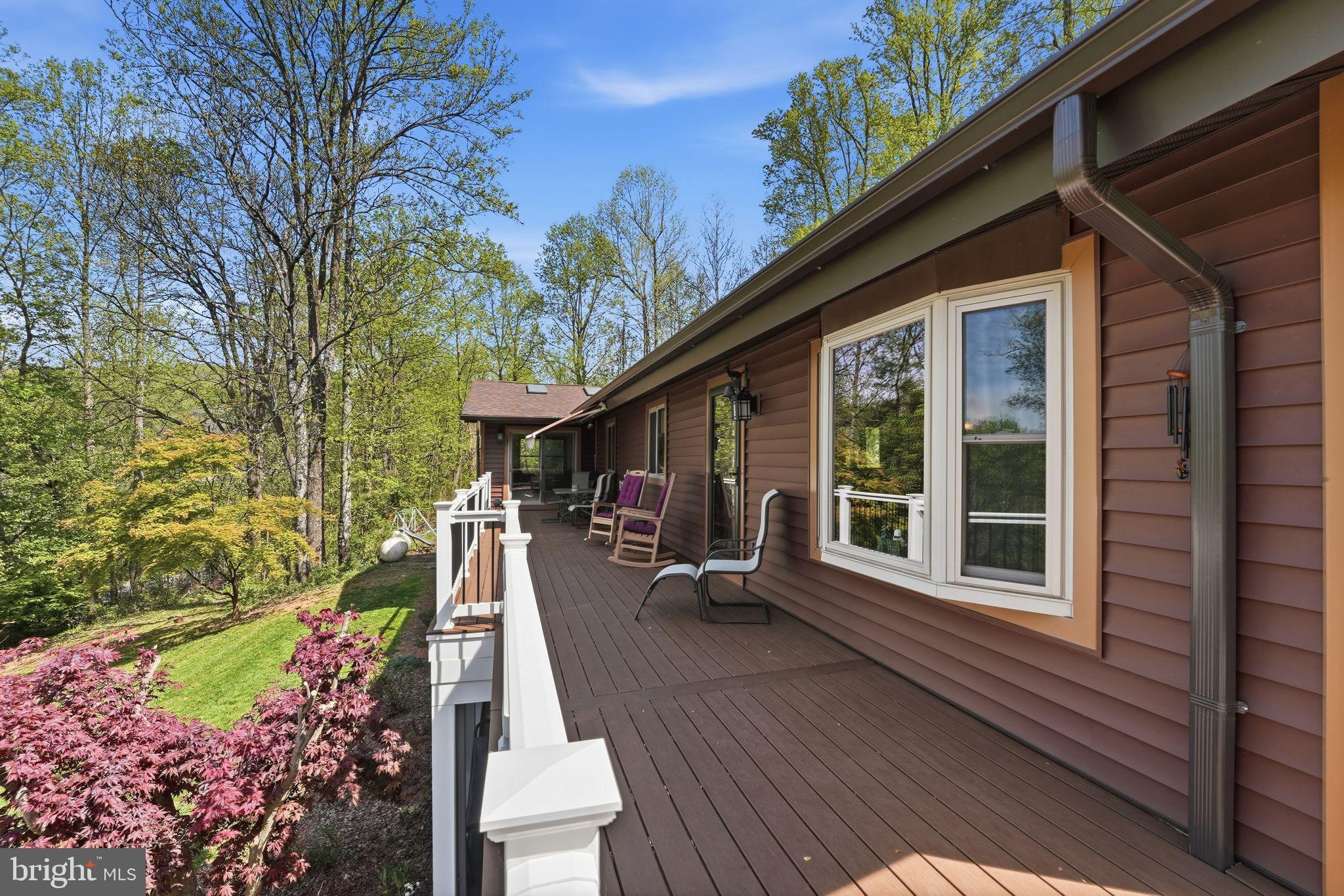 648 Creek Road Front Royal, VA 22630 - Photo 54 of 72 a view of a house with backyard sitting area and porch
