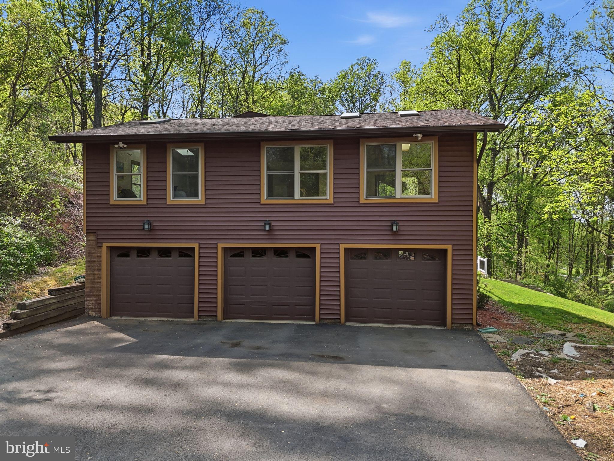 648 Creek Road Front Royal, VA 22630 - Photo 60 of 72 a front view of a house with a yard and garage
