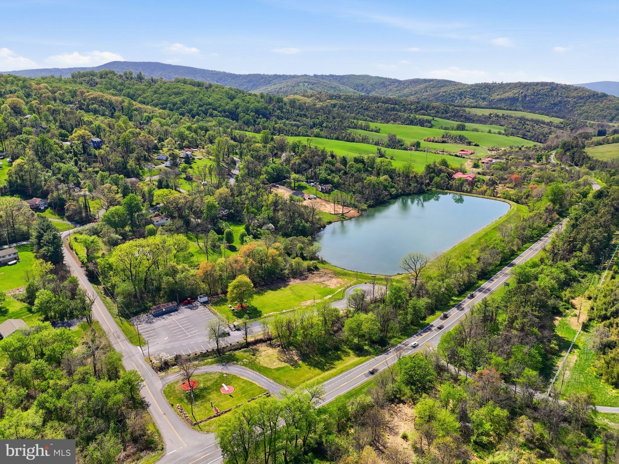 648 Creek Road Front Royal, VA 22630 - Photo 69 of 72 an aerial view of residential houses with outdoor space and river