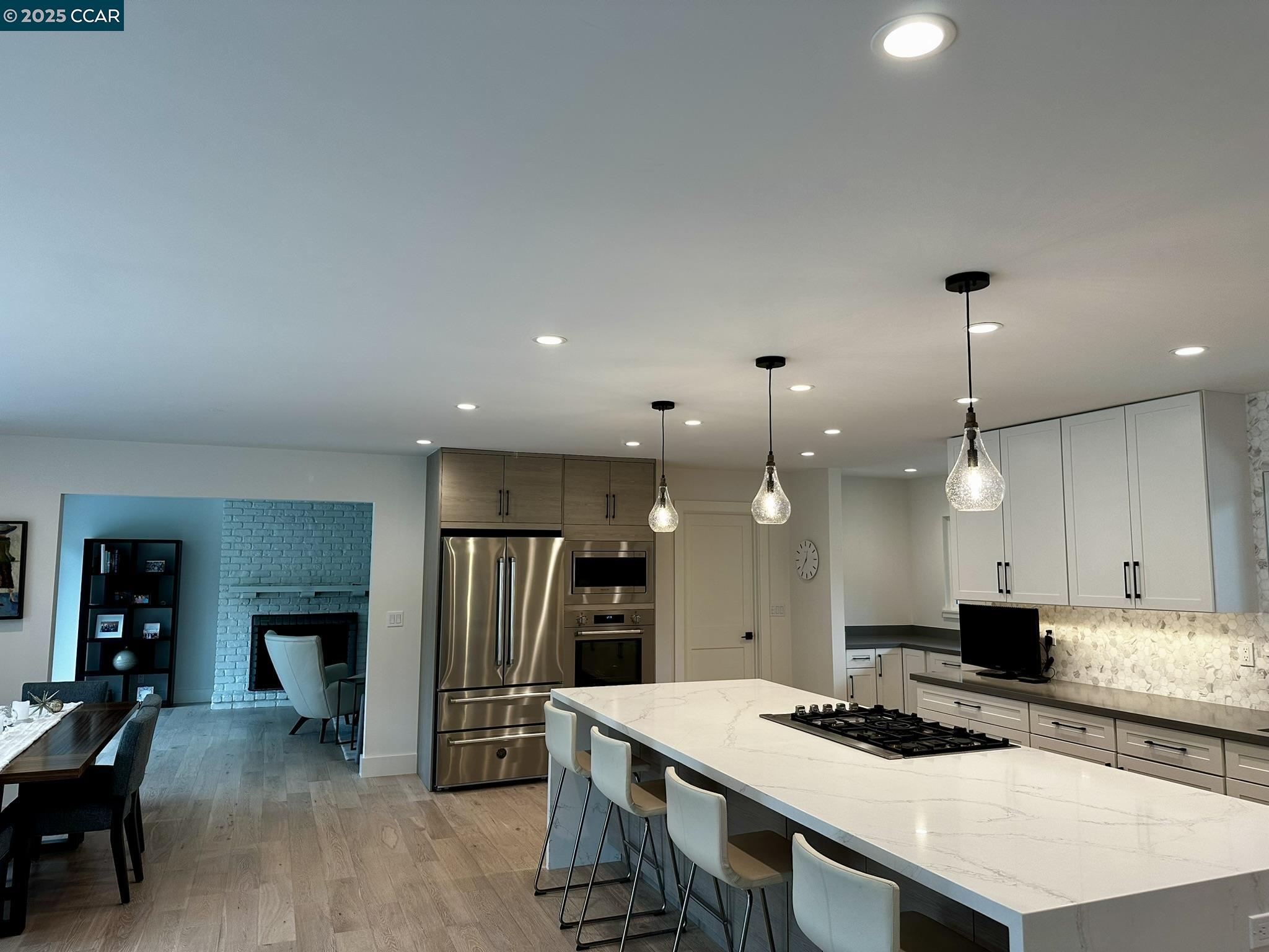 226 Alderbrook Place Moraga, CA 94556 - Photo 4 of 26 a large kitchen with a table and chairs