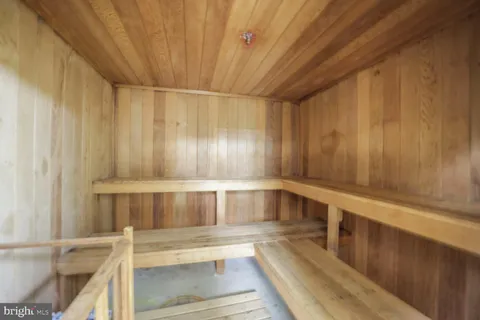 a view of entryway with wooden cabinets