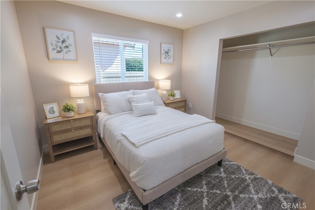 223 South Aprilia Avenue Compton, CA 90220 - Photo 18 of 46 a bedroom with a bed and a window