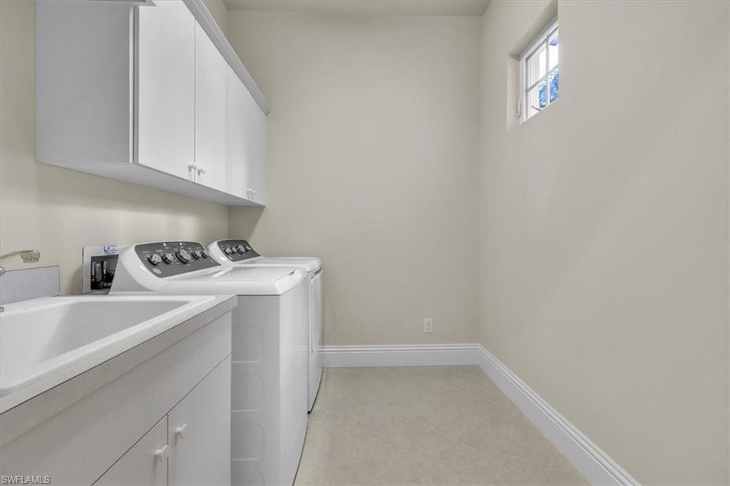 3331 Sanctuary Point Fort Myers, FL 33905 - Photo 13 of 50 a utility room with dryer and washer
